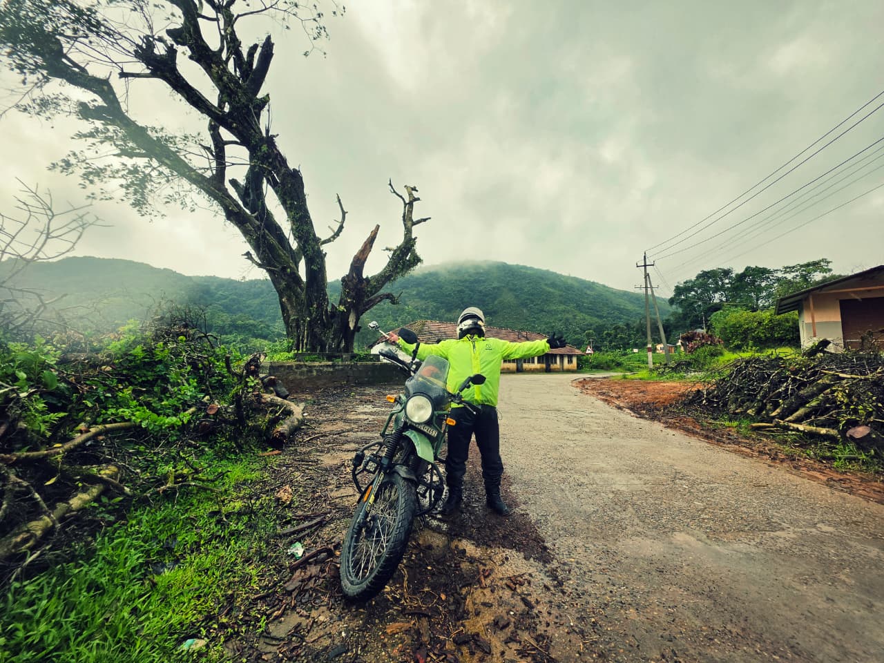 Rider celebrating on a mountain road